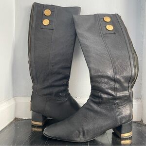 Black and brass tall Tory Burch zip up boots, size 8.5